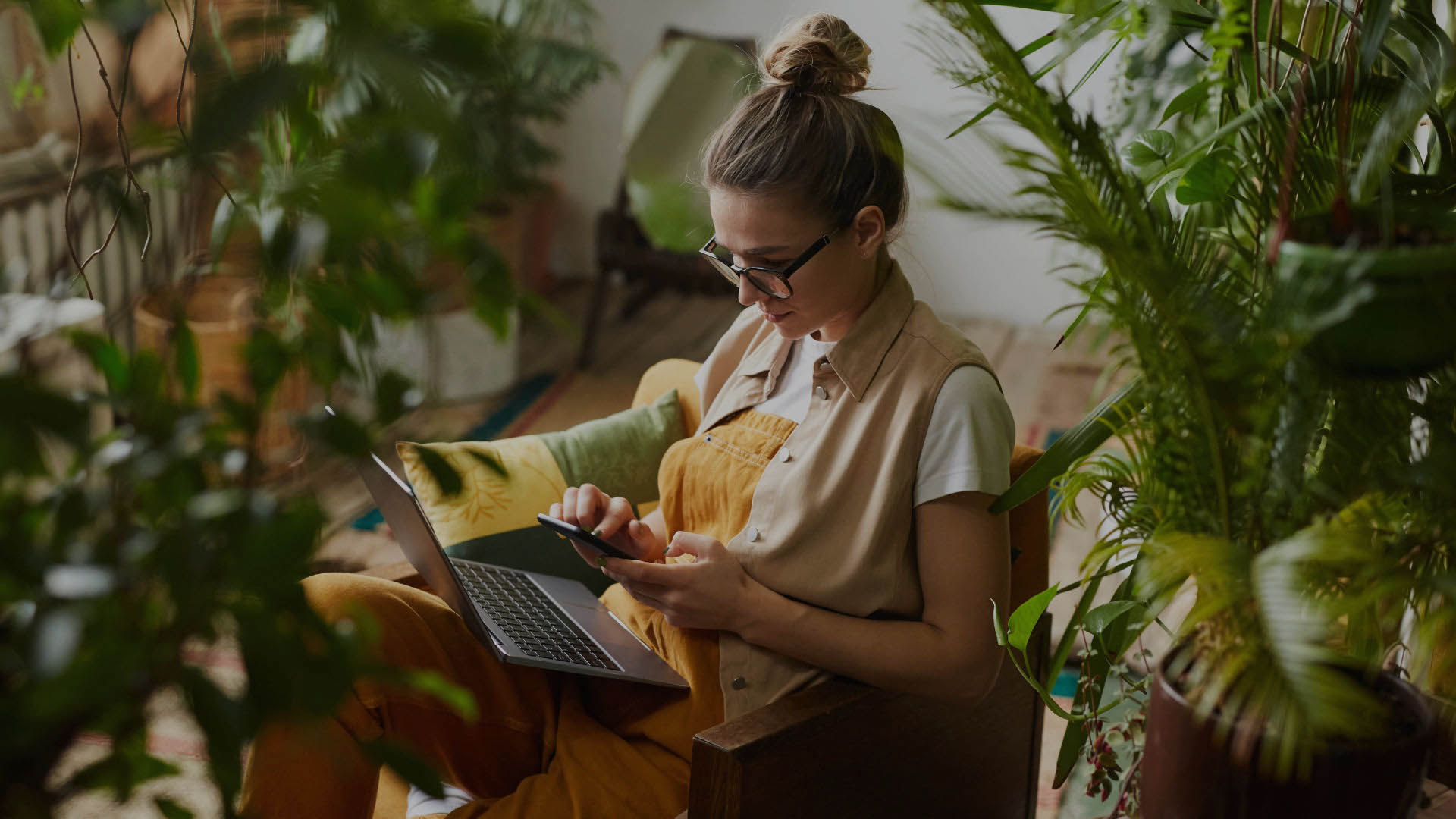 The owner of application working on laptop.